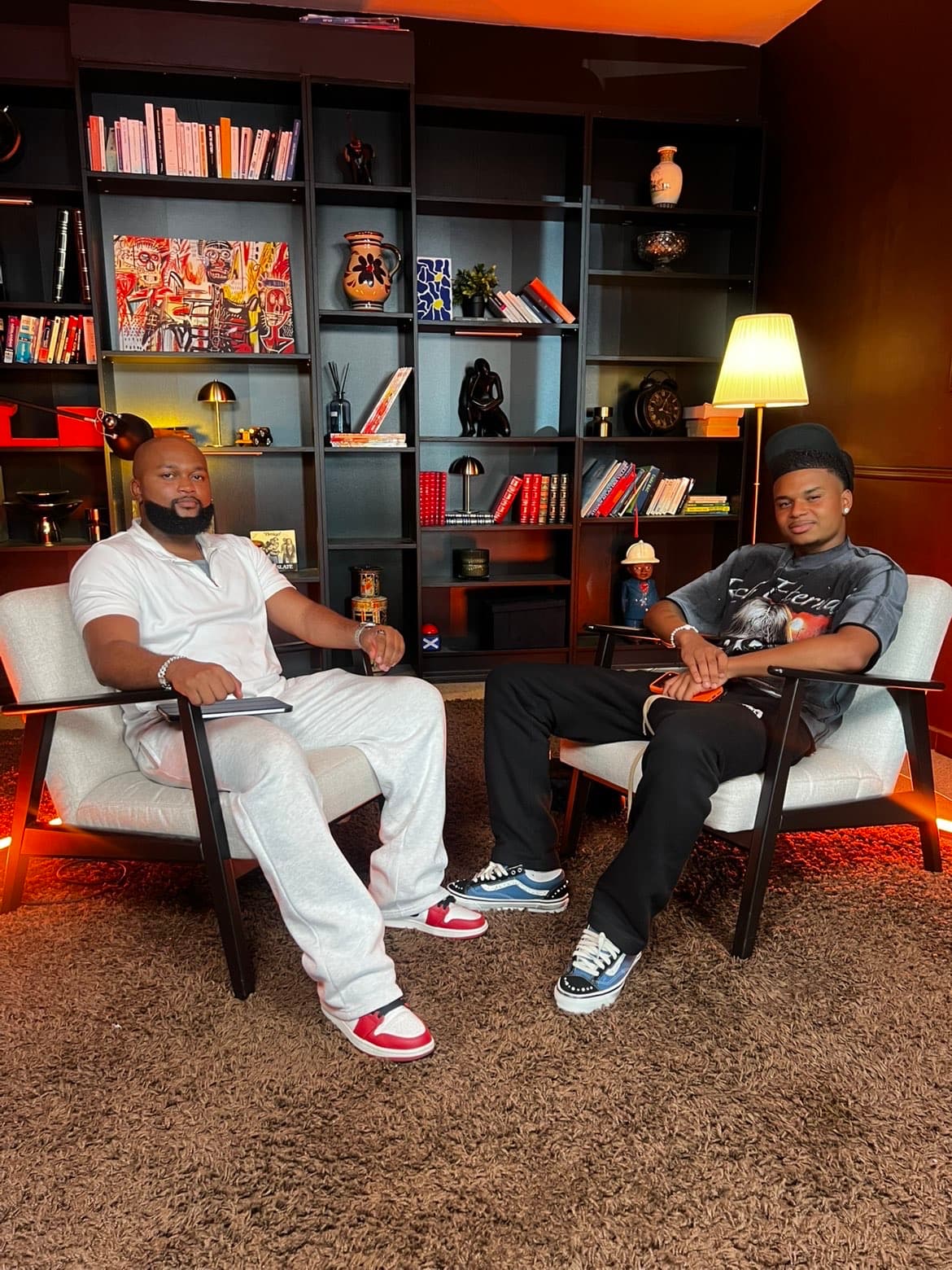 Antony Maole Luanyi and footballer Noah Saviolo seated on the Ascendium podcast set